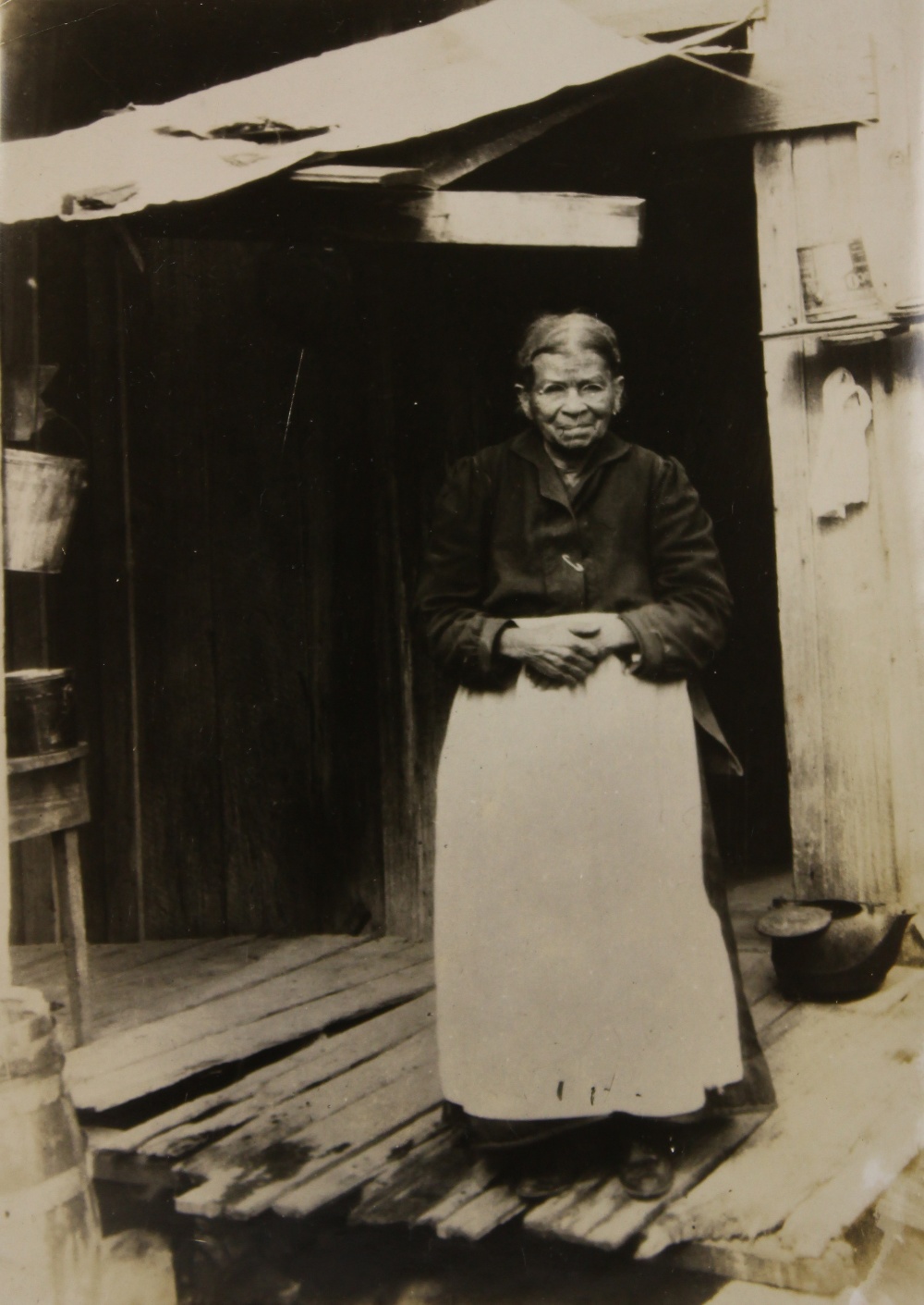 Lewis Hine (American, 1874-1940), Woman in Doorway, 1931, vintage gelatin silver print, unsigned,