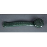 Chinese spinach jade ruyi scepter, the head incised with a figure crossing a bridge, the contoured
