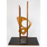 Danish Modern style teak figural sculpture, having an abstract geometric form, with rectangular