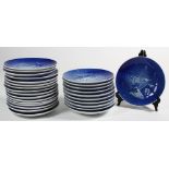 (Lot of 27) Royal Copenhagen Danish Jule-Aften holiday cabinet plates, having blue and white