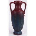 Van Briggle art pottery double handled vase in a blue to purple matte glaze having a water grass