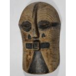 Kifwebe Society, Luba, D.R. Congo, mask, executed in black against yellowed white, somewhat small