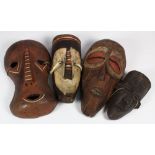 (lot of 30) West African style carved wood decorative face masks including Bembe, Dan, Wagoma-Babuye