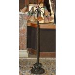 Tiffany style 'Tulip' floor lamp, having twelve downswept arms, continuing to polychrome floral form
