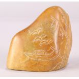 Chinese soapstone desk ornament, the boulder carved with a boat accented by birds (repaired), 4"w;