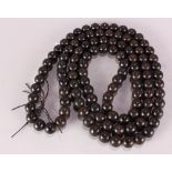 Chinese wooden prayer beads, consisting of 108 spherical beads strung as a necklace, 40.5"l