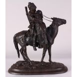 Patinated bronze figural sculpture, depicting a Russian Kazak mounted on a horse and carrying a