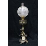 American Renaissance Revival parlor lamp circa 1870, having a reticulated reservoir holder,