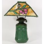 Arts and Crafts leaded glass oil lamp, the shade having four slag glass panels, with polychrome