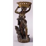 Renaissance style patinated bronze figural sculpture of a woman carrying a large basket, having an