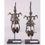 (lot of 2) Thai bronze figural spools/curtain pulls, each of the deities with hands out stretched