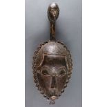 Yaure, Cote d'Ivoire, finely carved mask, with an extension above the head similar to a long neck