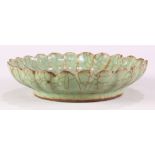 Chinese Longquan-type celadon foliate rim dish, composed of floral petal form raised on a low