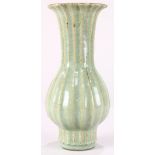 Chinese Longquan type trumpet vase, with a foliate rim trumpet neck above a pear shaped body with