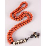 Sino-Tibetan coral necklace, consisting of 75 drum form coral beads together with a tianzhu/dzi type