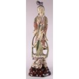 Chinese polychrome wood figural sculpture, the beauty with head slightly tilted, standing above a