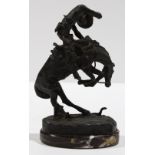 After Frederic Remington (American, 1861-1909), Rattlesnake, bronze sculpture atop a marble base,