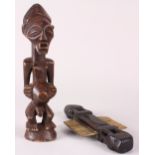 (lot of 3) Indigenous articles consisting of a Songye carved male figure; together with a New Guinea