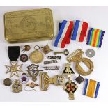 (Lot of 24) Group of WWI military war medals, ribbons, buttons, belt buckles, and a brass lidded