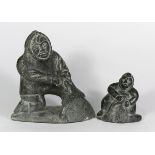 (Lot of 2) Carved stone Alaskan Inuit or Eskimo figural group, 20th Century, each depicting a