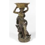 Renaissance style patinated bronze figural sculpture, depicting a maiden carrying a large basket,
