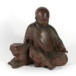 Japanese bronze sculpture of a young man, seated and cross legged, approx. 9.75"h x 9.5"w