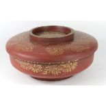 Japanese lacquered large circular lidded box, depicting gilt flowers on a vermilion ground,