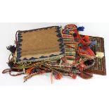 (Lot of 6) Woven wool carpet and Bahtiyari salt bags, with multicolor tassels, straps, and