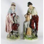 (lot of 2) Continental polychrome decorated figural sculptures, depicting a man and woman standing