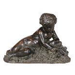 French patinated bronze figural sculpture, circa 1860, depicting a reclining cherub on a bed of