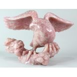 Chinese large rose quartz sculpture of an eagle spreading its wings and perching on a separate