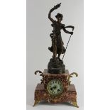 French figural mantle clock, the standing patinated metal figure of a woman carrying a scythe titled