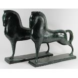 Pair of stylized patinated bronze horse figures after the antique, each depicted in classic pose and