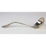 Shreve & Company sterling silver punch ladle decorated with scrolls on raised ribbing, and bearing a