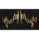 Pair of Louis XV style gilt bronze sconces, each having two lights suspended from a shield form