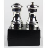 (lot of 4) Two pairs of Empire sterling silver mounted salt shakers and pepper mills, one set in