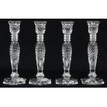 (lot of 4) Waterford single-light crystal candlesticks, having a faceted baluster form standard