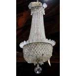 Continental crystal chandelier, having an acanthus decorated circular top suspending the cascading