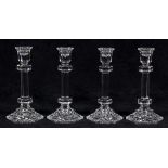 (lot of 4) Waterford single-light crystal candlesticks, having a faceted standard and rising on a