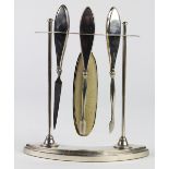 English 20th century sterling silver mounted four piece manicure set on stand including file,