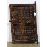 Mali Dogon style bas-relief carved door, having approximately 20 carved figurines, 32.5"h x 21.5"w x