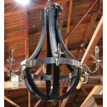 Moderne six light chandelier, having an ebonized frame, above six chrome scrolled arms, 34.5"h