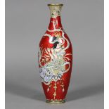 Japanese cloisonne vase, having a compressed ovoid body, with a celestial deity playing a flute on