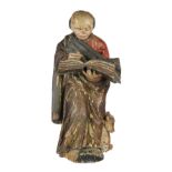 Continental carved wood Santos figure, 19th Century, polychrome decorated, depicting a holy figure