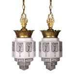 Pair of American Art Deco hanging fixtures, each having a diamond form support continuing to the