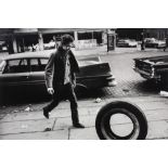 Jim Marshall (American, 1936-2010), Bob Dylan Kicking Tire, Seventh Ave. NYC