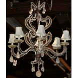 Venetian style crystal and rock crystal chandelier, having six lights, each rising on a scroll