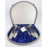 (lot of 13) Sheffield mother of pearl handled fish set for six, each fork and knife rested in a