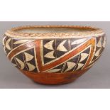 Native American Acoma pottery vessel, having a tapered form with abstract geometric designs,