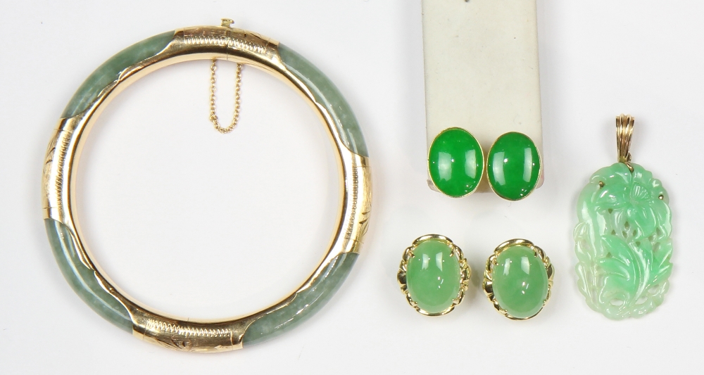 (Lot of 4) Jade and yellow gold jewelry comprised of one pair of earrings featuring (2) oval jadeite